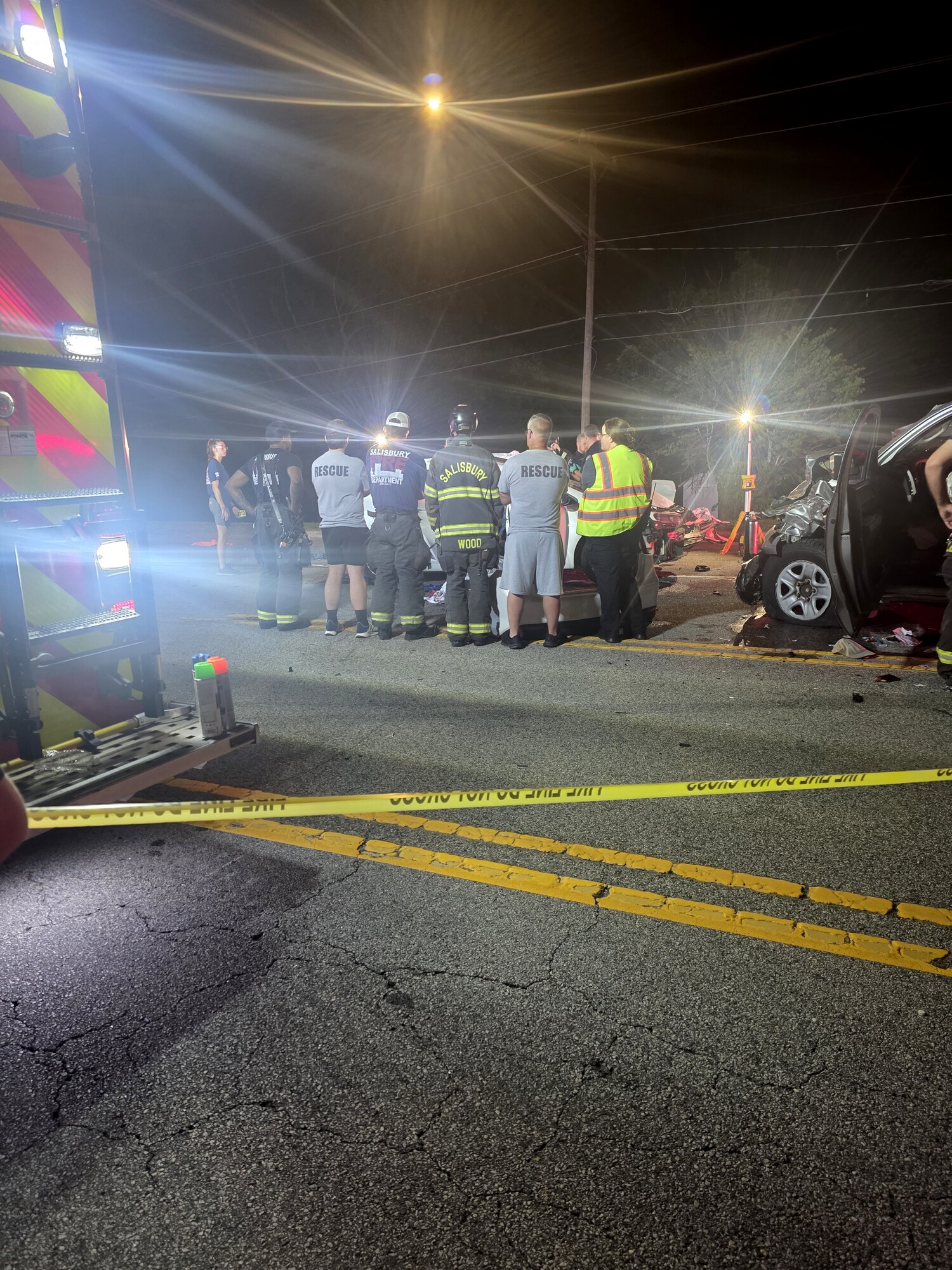 First responders surrounding my dad at the accident scene