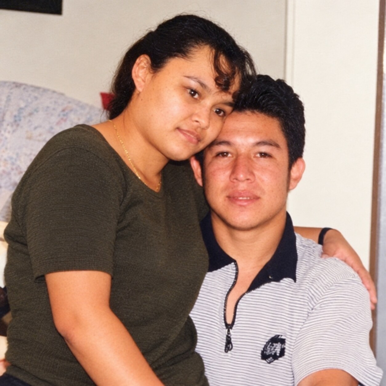 My dad and my mom embracing at home