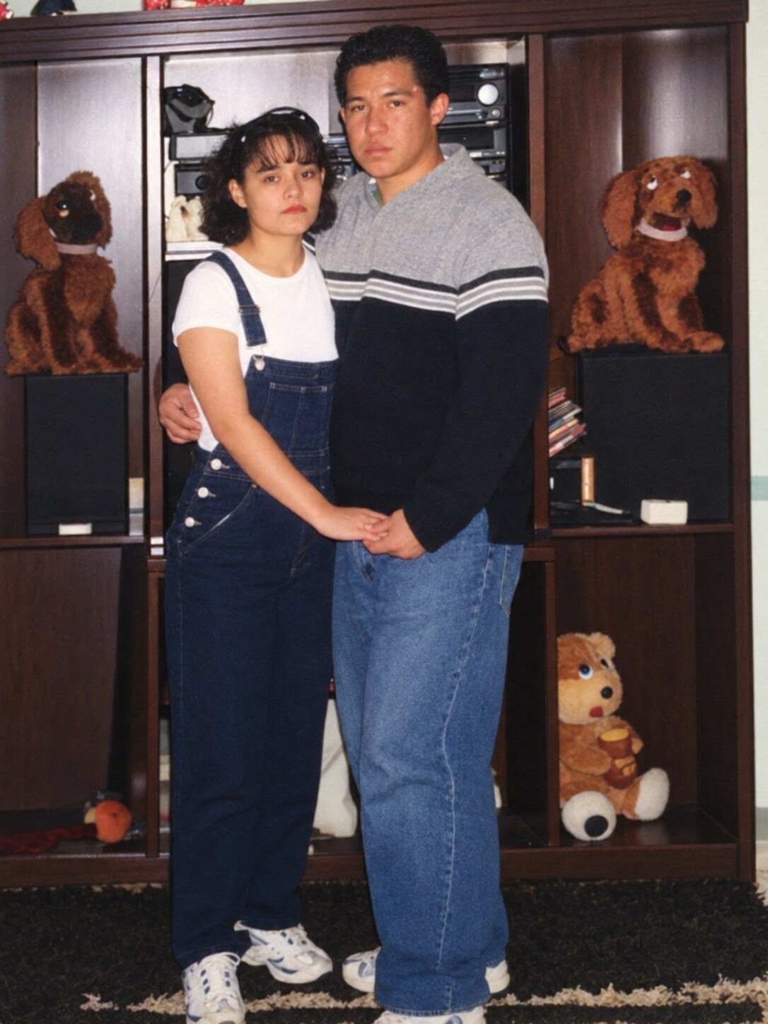 My dad and my mom standing together at home