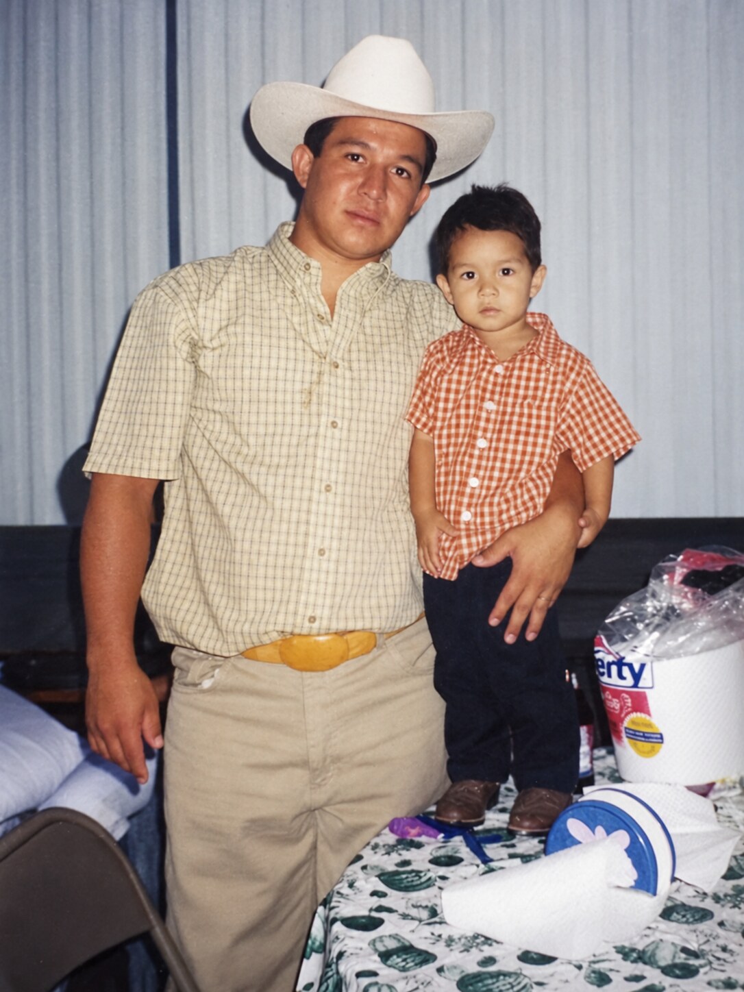 My dad holding a small child
